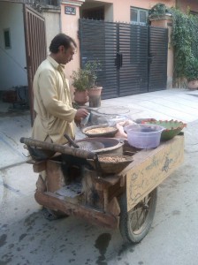 Live fire range...thgat is a fire in the box and that cart is wooden...selling roasted nuts in the street, that is a
